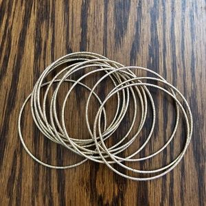Twelve Skinny Gold Bangles